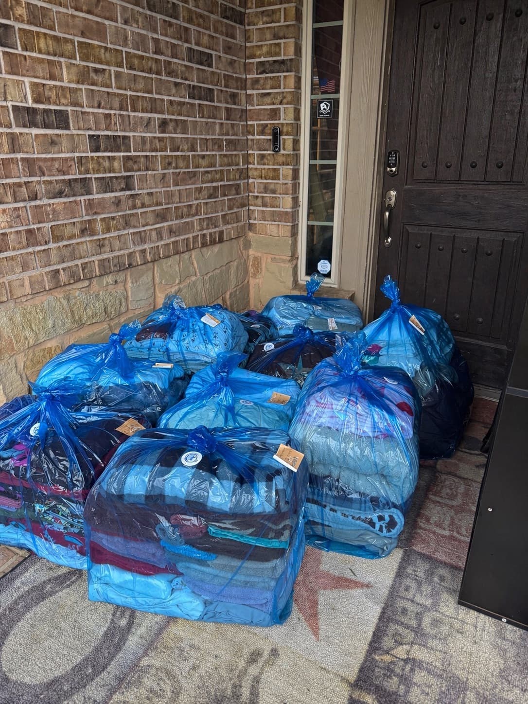 Multiple bags of laundry ready for pickup at a Katy-area home