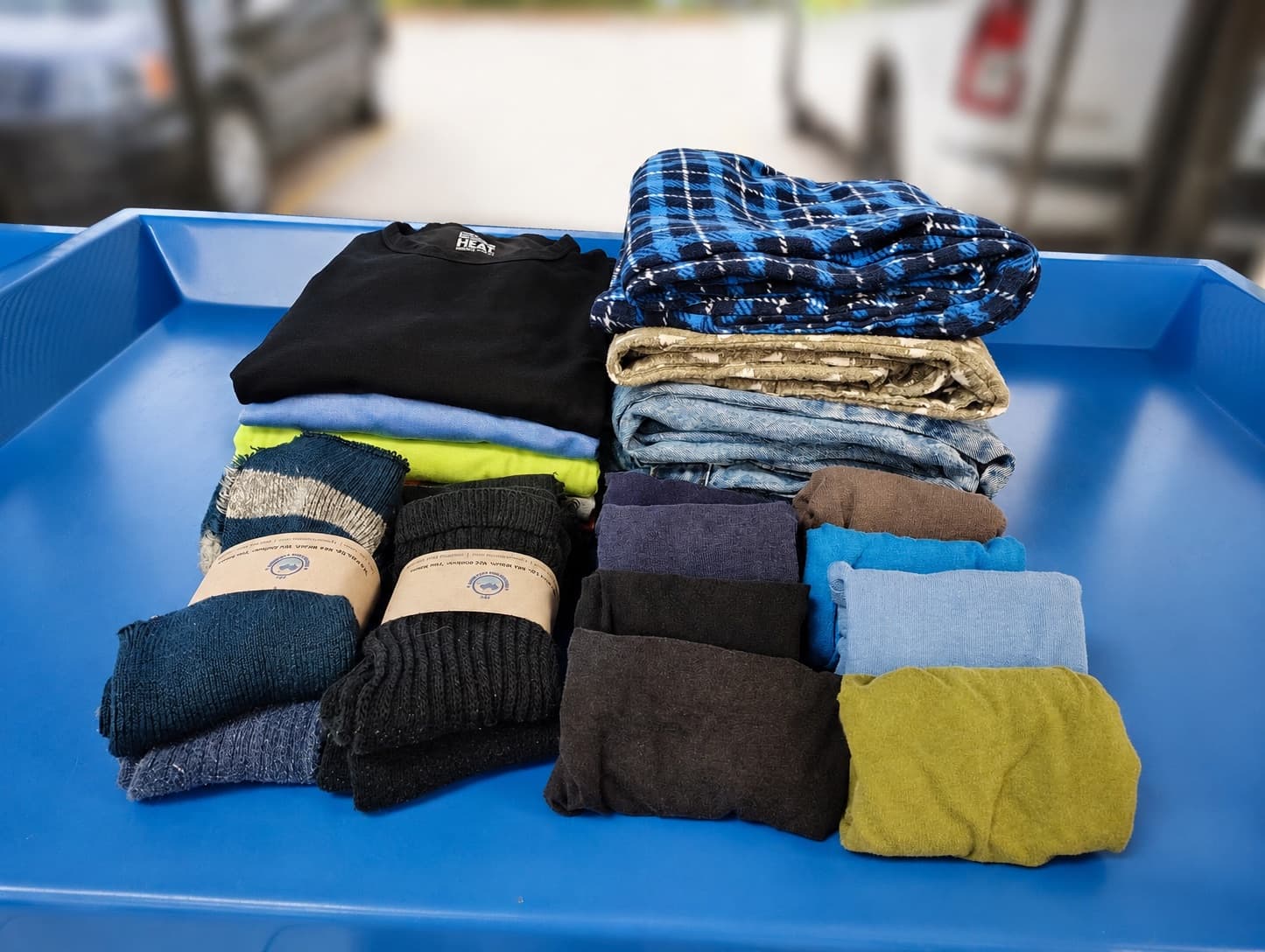 Folding table with folded laundry at Fry Washateria
