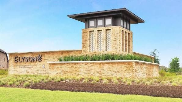 Elyson community entrance monument tower with landscaped stone base
