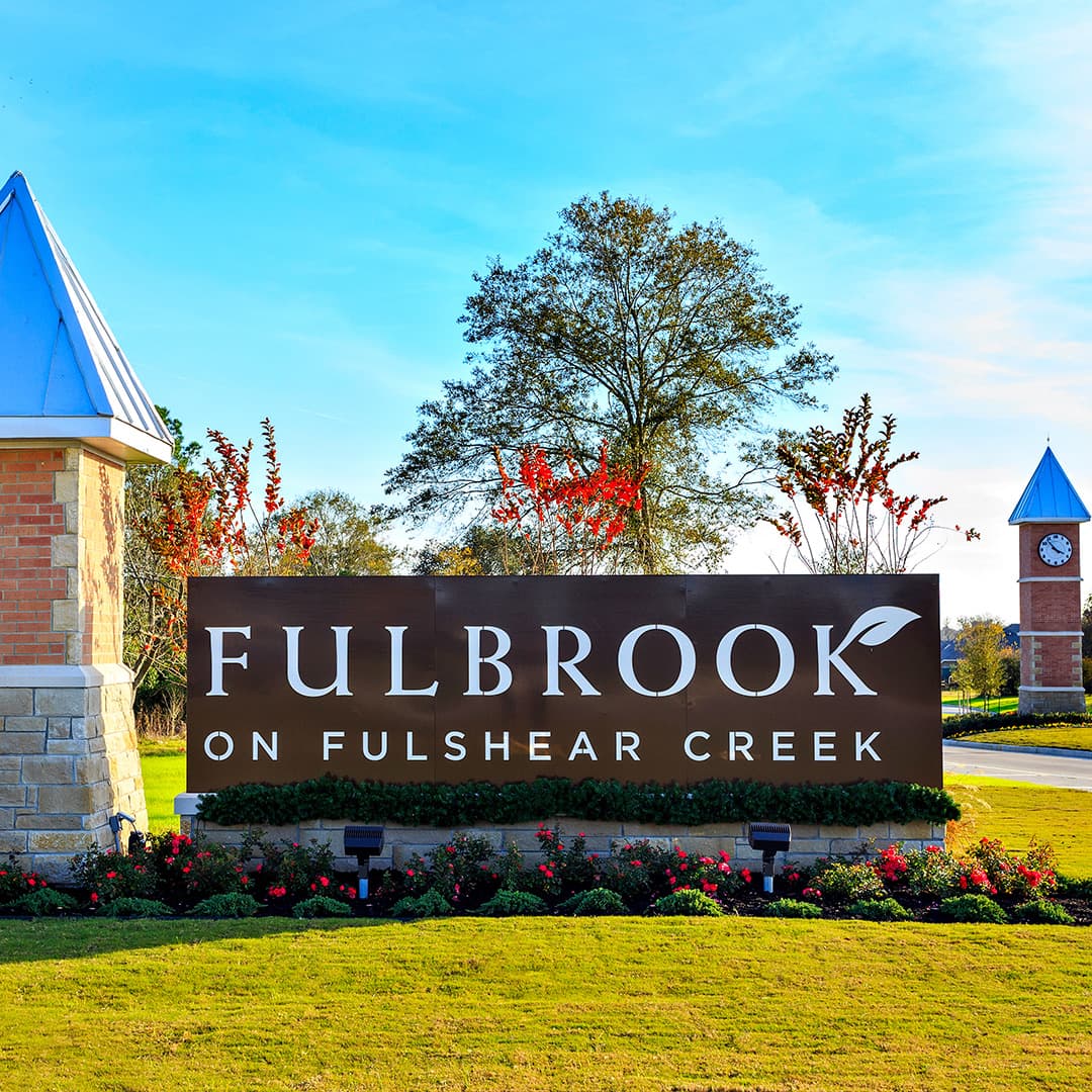 Fulbrook on Fulshear Creek monument sign with the community clock tower in the background